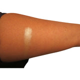 Swatch of cream highlighter on arm.